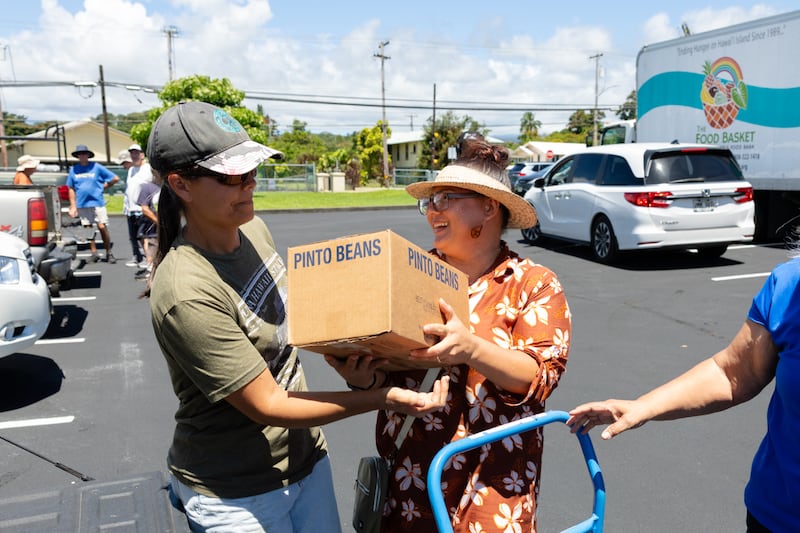 Members of The Church of Jesus Christ of Latter-day Saints unload food donations from the Church in Hilo, Hawaii, on June 13, 2026. Hawaii is the 50th state to receive a donation in honor of the 250th anniversary of the United States.
