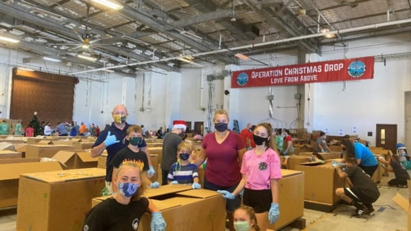 The Hartley family in Guam poses for a photo while participating in Operation Christmas Drop, a U.S. Pacific Military Forces-sponsored project that airdrops food and supplies to remote areas of the region, as part of the #LightTheWorld campaign in December 2020.