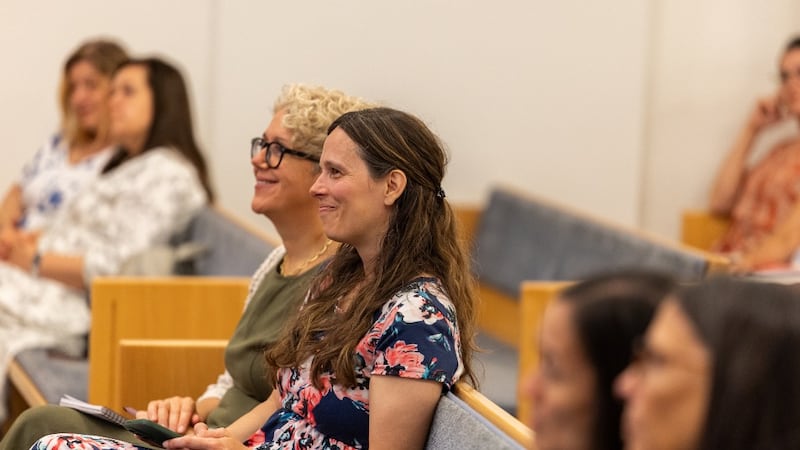 Women listen to Sister Kristin M. Yee during a devotional in Offenbach, Germany, on Aug. 29, 2026.