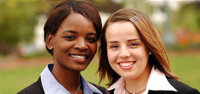 Sister missionaries Kapungwe Chishala (L) (Africa) and Kelly Barreto (Brazil) during LDS General Con