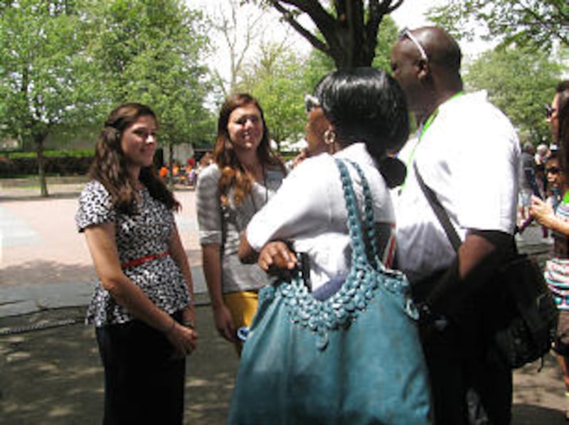 Sister Tania Jane Guerra, left, and Sister Hillary Schwendiman converse with visitors individually w
