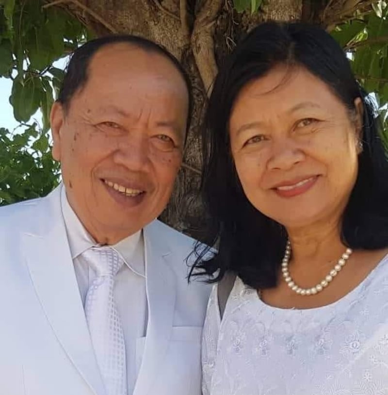 Sam Sophon and his wife, Chan Sovan, snap a photo while attending the broadcast of the Bangkok Thailand Temple dedication Oct. 22, 2023, at their stake center in Phnom Penh, Cambodia.