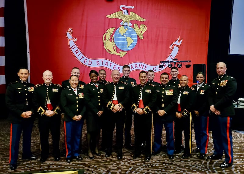 Retired U.S. Marine Maj. Yen Soto, third from the left, poses for a photo with fellow officers at the Marine Corps Ball at San Diego, California, in November 2019.