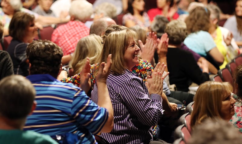 Joanna Beck of Peoria, Arizona applauds during a Marvin A. Goldstein and Janice Kapp Perry hymn sing-along class at BYU Education Week in Provo on Tuesday, Aug. 21, 2018.