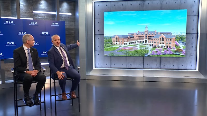 Brigham Young University President C. Shane Reese shows an architectural rendering of the new BYU School of Medicine alongside Dr. Mark J. Ott, the school's dean, in an announcement in Provo, Utah, Wednesday, Oct. 14, 2026.