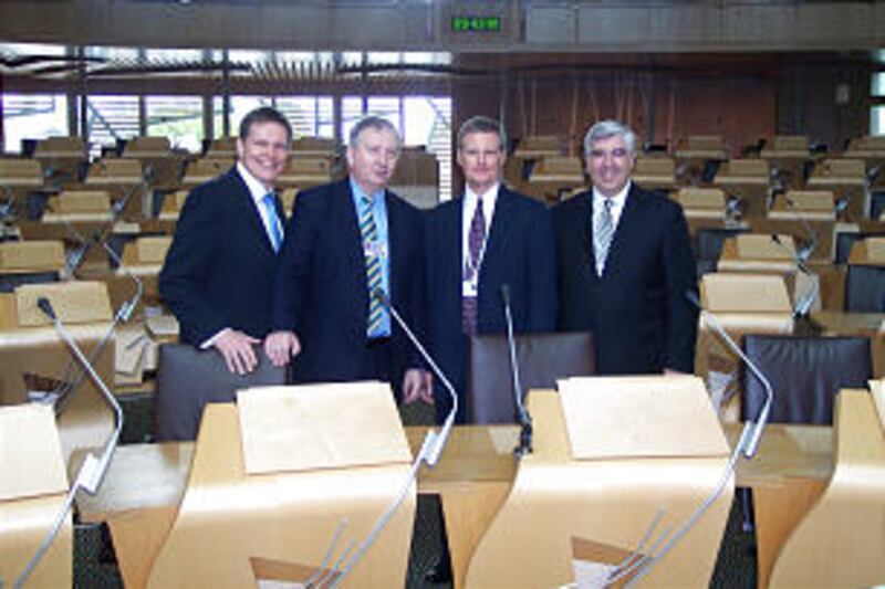 At First Minister's Seat are Elder Stephen C. Kerr; left, Brian Adam, MSP; Elder David A. Bednar; an