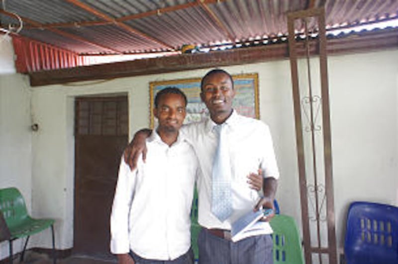 Returned missionaries Andualem Birhana Milkesa, left, and Tamrat Achalu Negera attend church in an o