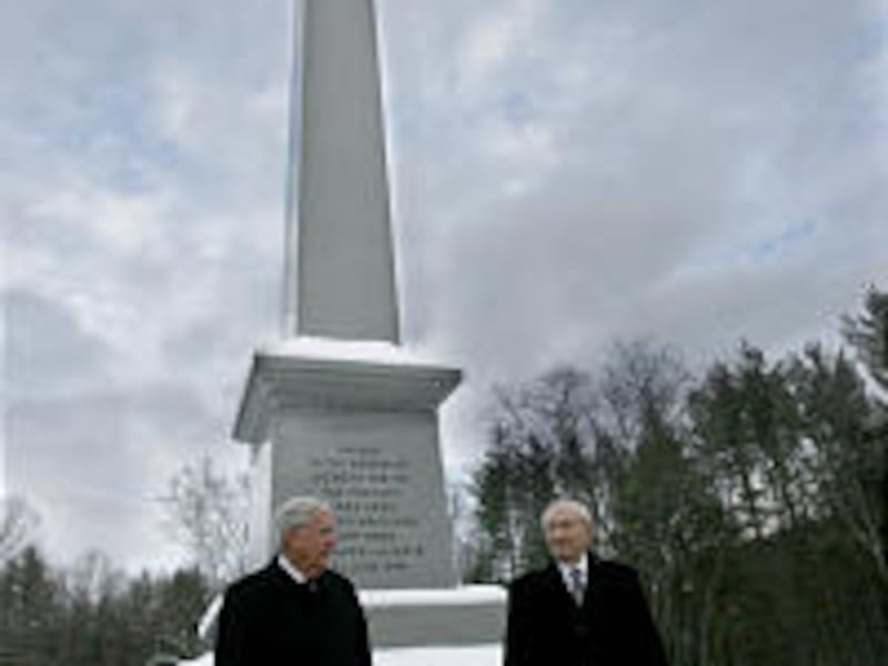 President Gordon B. Hinckley and Elder M. Russell Ballard stand stand at the granite obelisk erected