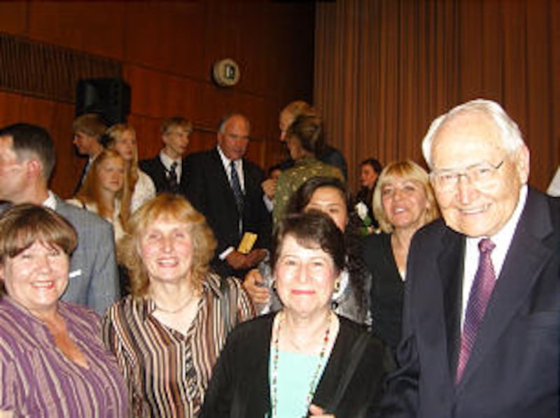 Church members from Daugavpils, Latvia, meet Elder L. Tom Perry of the Quorum of the Twelve, and his