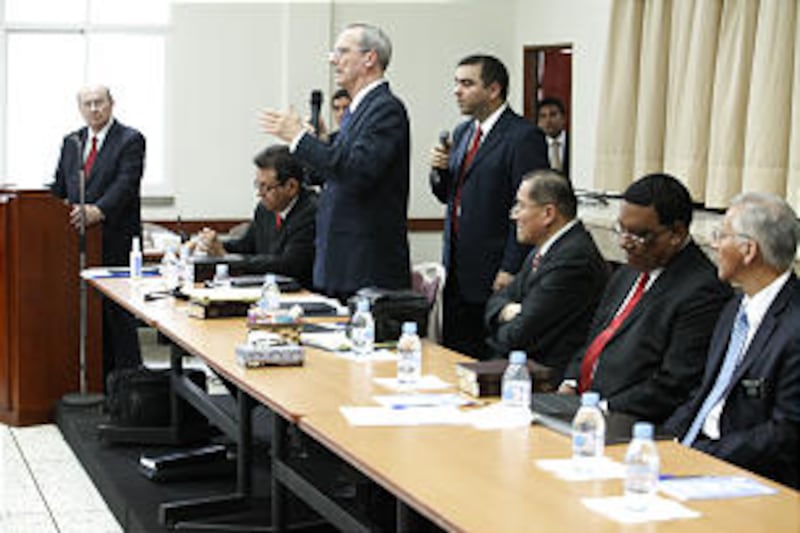 Elder Tad R. Callister of the Presidency of the Seventy, center, speaks during priesthood leadership