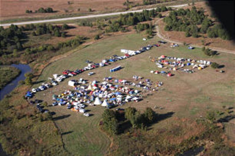 Boy Scouts and leaders from eight stakes and 55 units set up camp on Church-owned property at Pawhus