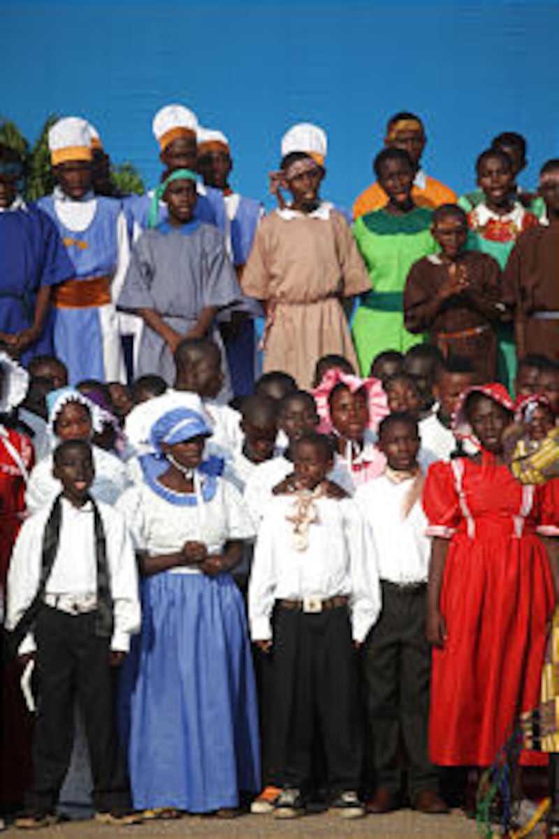 Youth dressed in pioneer clothing sing in Accra, Ghana.