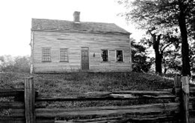Restored Joseph Smith Sr. farm home has regained original appearance, including a central chimney.