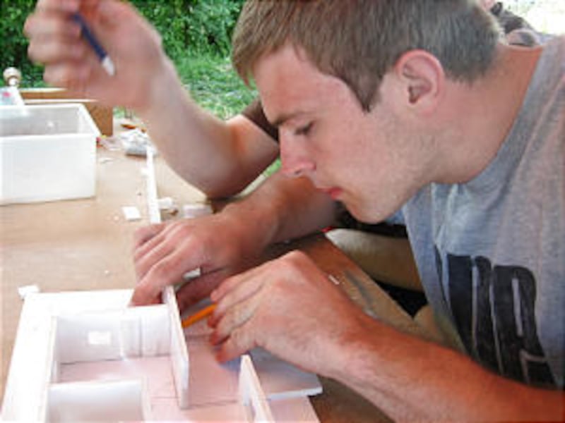 Eagle Scout Craig Richins completes project for the model design merit badge.