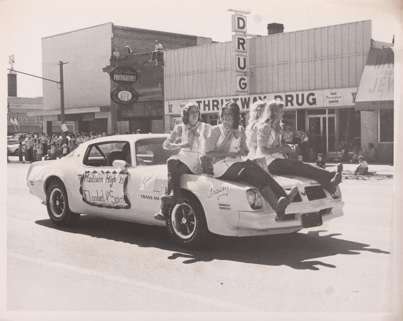 With a sign that reads "Madison High is flooded with spirit," students ride in the Fourth of July Parade in Rexburg, Idaho, on July 3, 1976 — one month after the Teton Dam flood.
