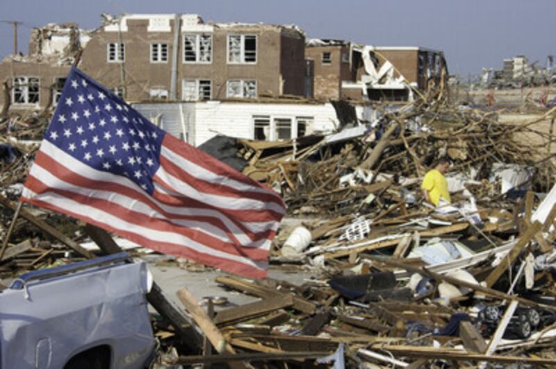 More than 550 Church members wearing "Helping Hands" T-shirts volunteered time and labor to help fam