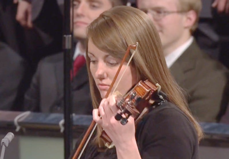 Violinist, Sister Tiffany Stamm, accompanied an institute choir that provided the music for a Church
