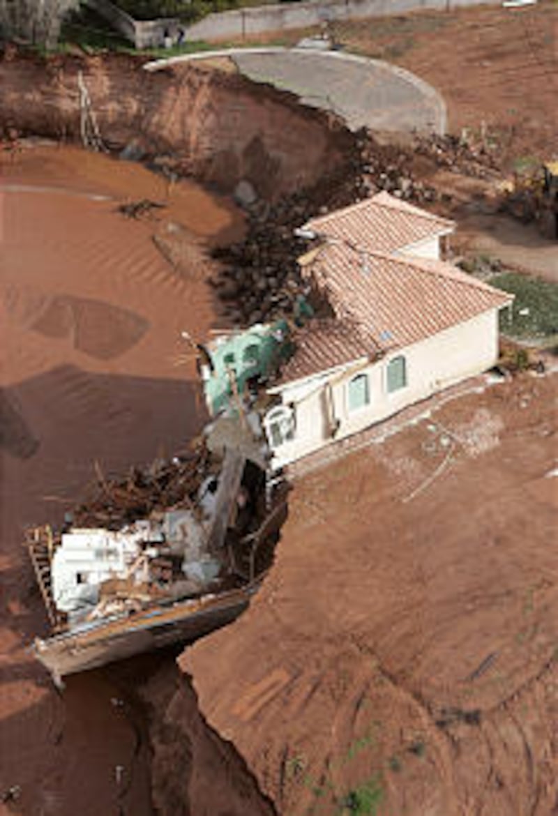 A badly damaged home in Green Valley, by St. George. Flood waters along the Santa Clara river washe