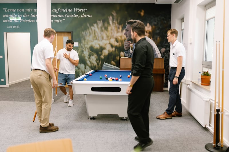 Young adults spend time together at the Frankfurt Institute of Religion in Frankfurt, Germany, June 27, 2026.