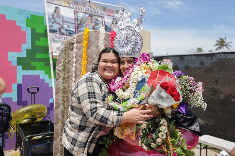 BYU–Hawaii graduates take photos outside the Cannon Activities Center following commencement on Friday, April 17, 2026, in Laie, Hawaii.
