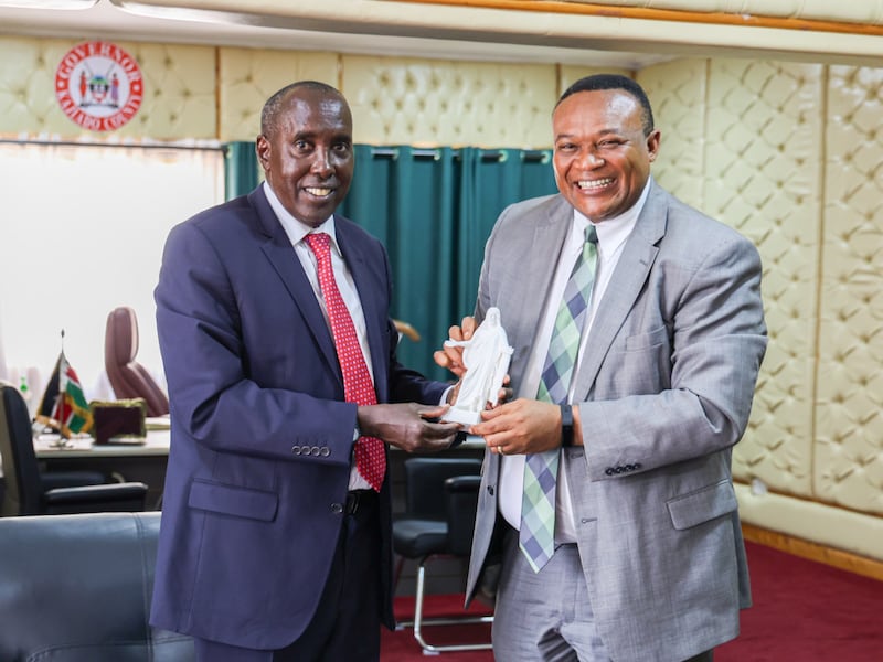 Elder Thierry K. Mutombo, General Authority Seventy and Africa Central Area president, right, presents a Christus statuette to Joseph Ole Lenku, Kajiado county governor in Kaijado County, Kenya, on July 30, 2025.