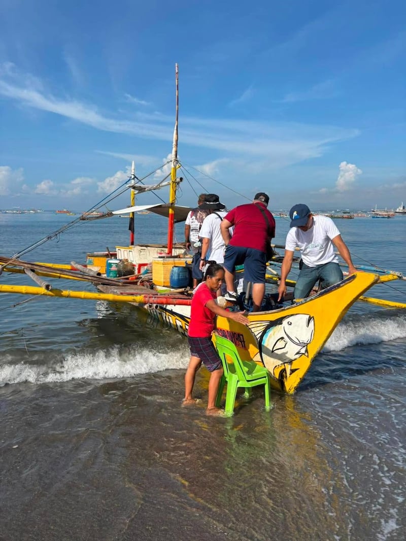 Local members of The Church of Jesus Christ of Latter-day Saints prepare to transport 200 food kits in a rented boat from General Santos City to units in Glan and Alabel on June 10, 2026, following the recent 7.8 earthquake in Mindanao, Philippines.