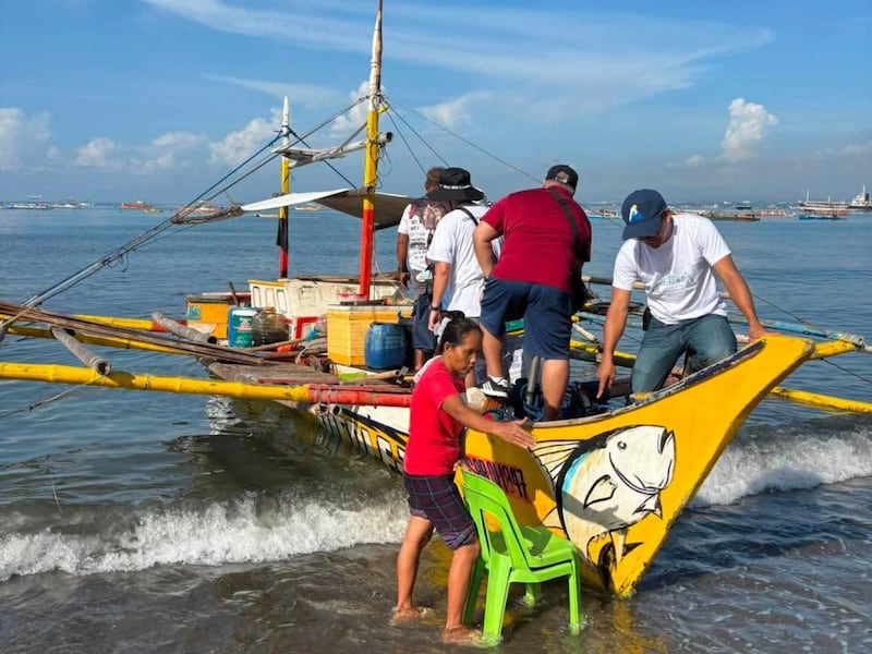 Local members of The Church of Jesus Christ of Latter-day Saints prepare to transport 200 food kits in a rented boat from General Santos City to units in Glan and Alabel on June 10, 2026, following the recent 7.8 earthquake in Mindanao, Philippines.