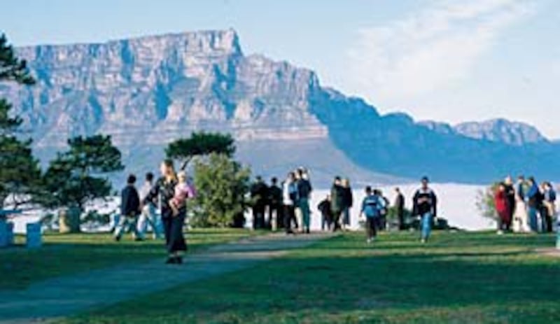 Members commemorate 150-year anniversary on Signal Hill in view of Table Mountain on left.
