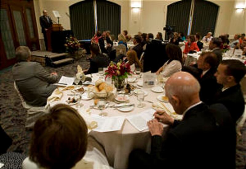 President Thomas S. Monson speaks at a recognition banquet honoring Wilford C. Wood, who acquired se