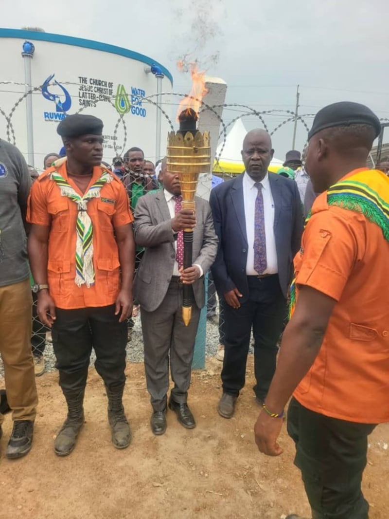 Mwanza Tanzania District President Michael Itongwa holds the Uhuru Torch in Zumve Village, Tanzania, Aug. 20, 2026.