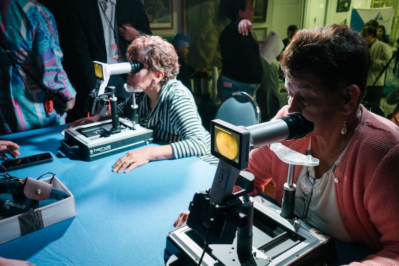 Patients look into viewers as take retinal diagnostic exams donated by The Church of Jesus Christ of Latter-day Saints to the Mexican Diabetes Federation on Oct. 24, 2024, in Mexico City, Mexico.