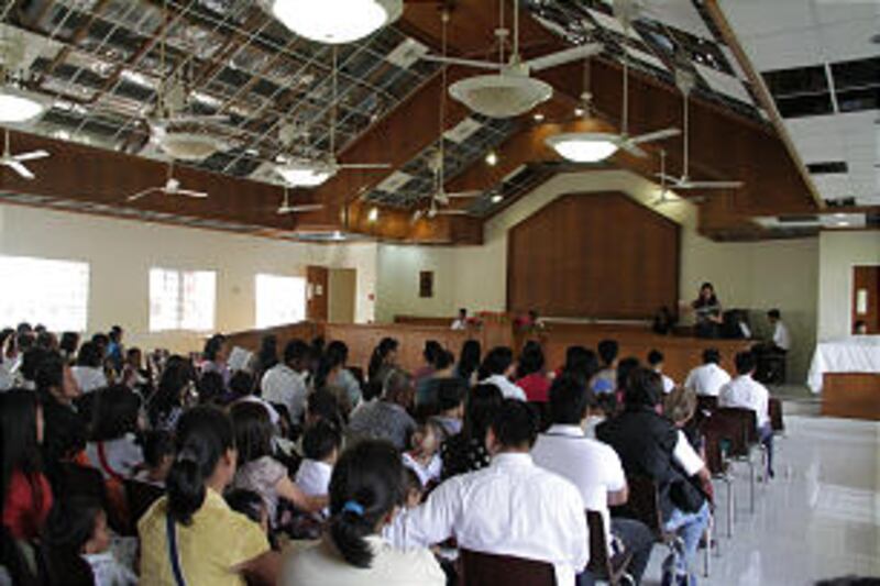 Latter-day Saints in the Philippines gather for sacrament meeting in a chapel damaged by Typhoon Hai