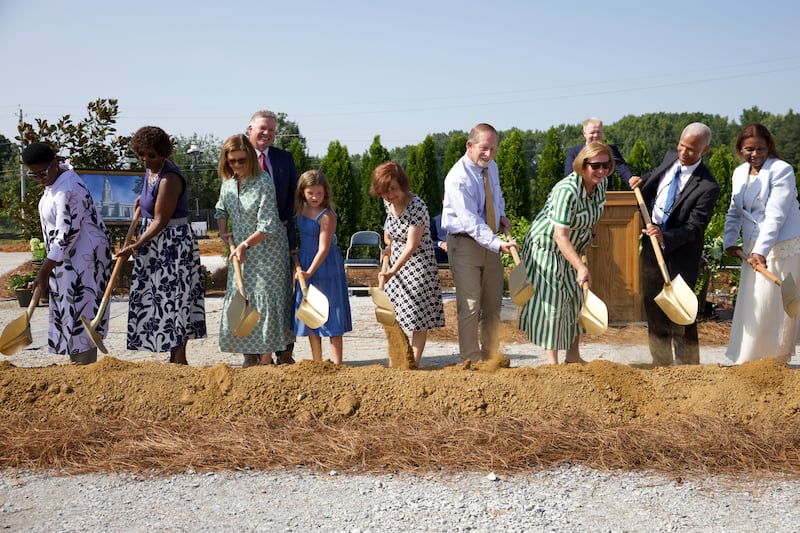 Elder John D. Amos, a General Authority Seventy and member of the Church’s United States Southeast Area presidency, second from right; and his wife, Sister Michelle Amos, right, join others in breaking ground for the Huntsville Alabama Temple on Saturday, Aug. 15, 2026, in Madison, Alabama.