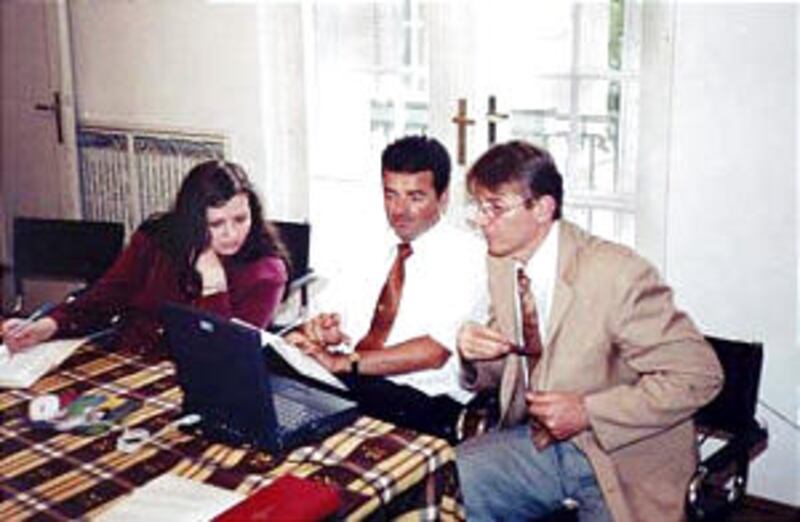 President Radomir Vucenovic of Sremska Mitrovica Branch, right, Djordje Ivanovic, first counselor, a