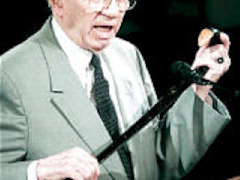 President Gordon B. Hinckley displays cane used by Brigham Young to mark the location of the Salt La