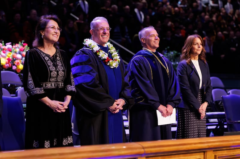 Elder Ulisses Soares of the Quorum of the Twelve Apostles and his wife, Sister Rosana Soares, left, and BYU President C. Shane Reese and his wife, Sister Wendy Reese, right, participate in commencement on Thursday, April 23, 2026, in the Marriott Center in Provo, Utah.