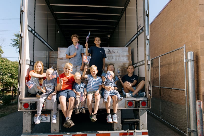 JustServe volunteers celebrate the delivery of a truckload of food from The Church of Jesus Christ of Latter-day Saints to the Partners INW food pantry in Spokane Valley, Washington, on Thursday, June 25, 2026.