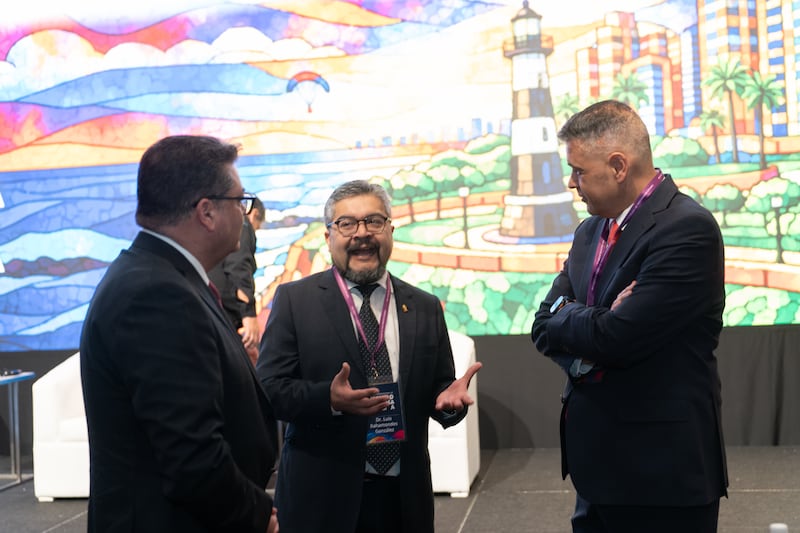 Elder Juan Pablo Villar, a General Authority Seventy and president of the Church's South America Northwest Area, right, visits with attendees at the first International Symposium on Religious Freedom in Lima, Peru, Aug. 4-5, 2026.