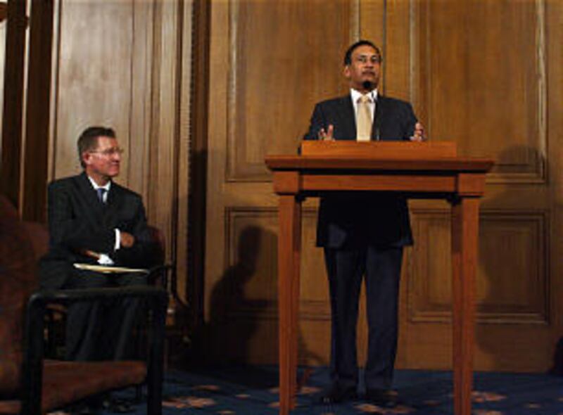 Pakistani ambassador Husain Haqqani, right, speaks during a press conference regarding LDS humanitar