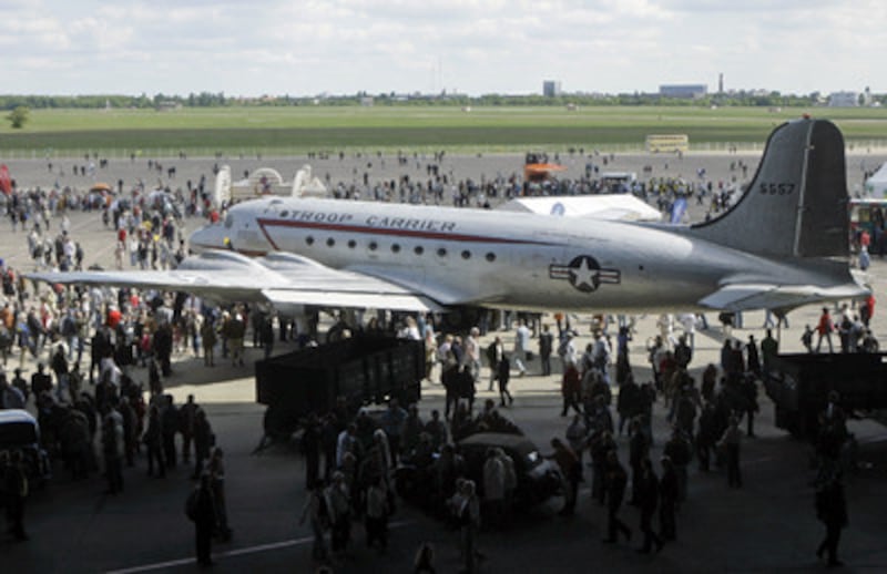 A troop carrier Douglas C-54 Skymaster, also nicknamed 'Candy Bomber', is on display on the disused