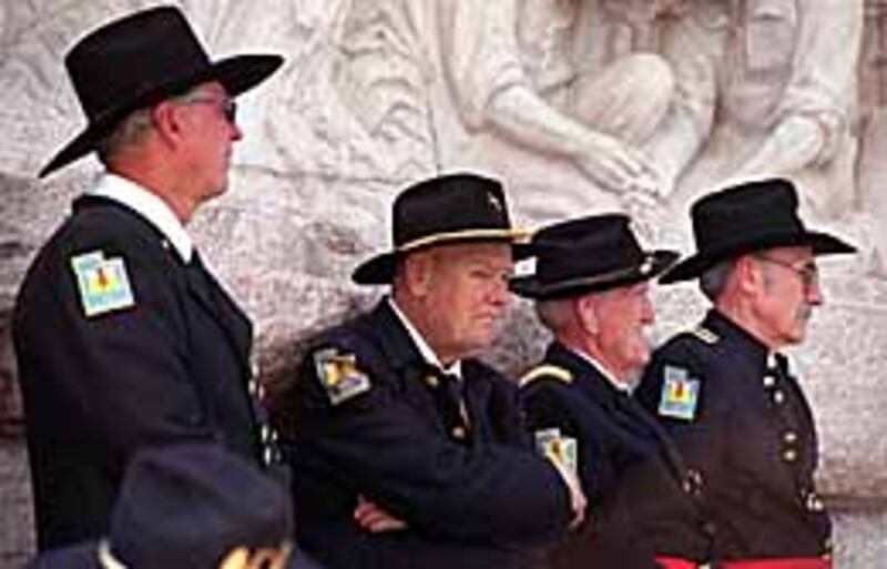 Members of U.S. Mormon Battalion listen to program at Heritage Day observance.