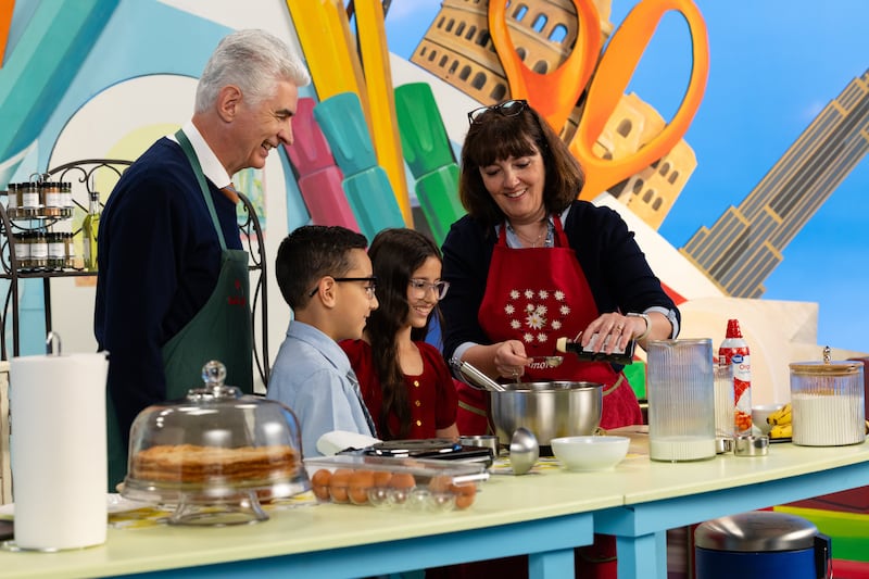 Elder Gérald Caussé and Sister Valérie Caussé, make crêpes with two child hosts during the September 2026 Friend to Friend broadcast.