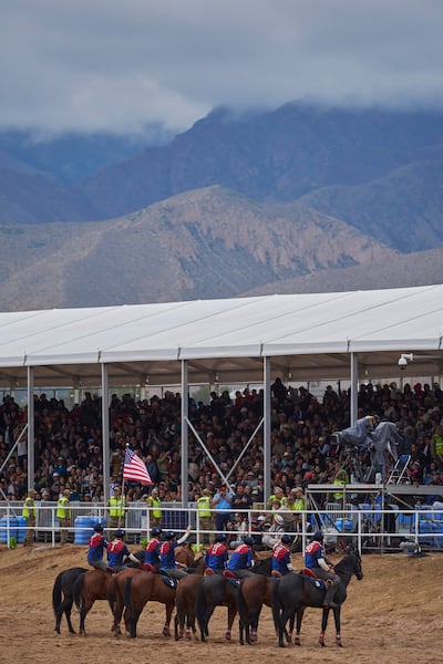 With the American flag waving, Team USA lines up together on their horses during the World Nomad Games, held Aug. 31 to Sept. 6 in Bishkek and Cholpon-Ata, Kyrgyzstan.
