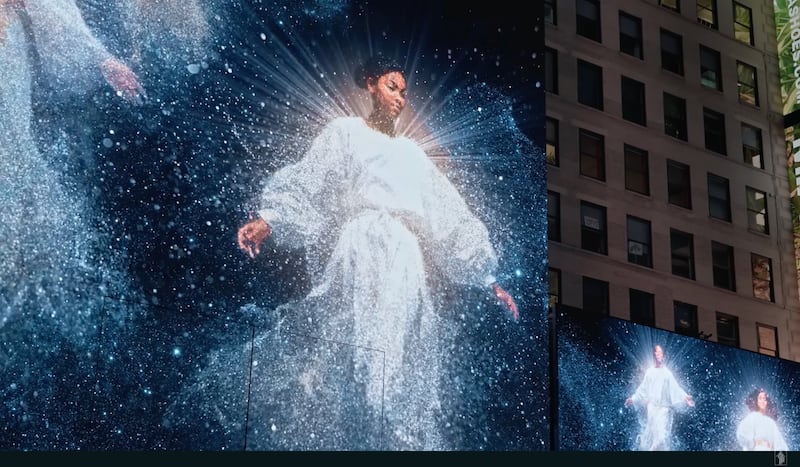 Angels are portrayed on billboards and screens in New York City in a scene from the 2023 Light the World video, "A Silent Night Surprise in Times Square."