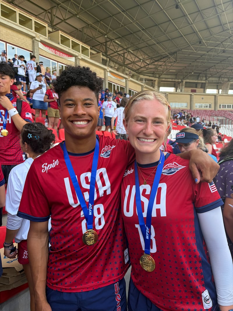 Silas Bell and Emilee Jensen take a picture together after winning the gold medal with Team USA's mixed team at the World Junior Ultimate Championships in Logroño, Spain, on July 18, 2026.