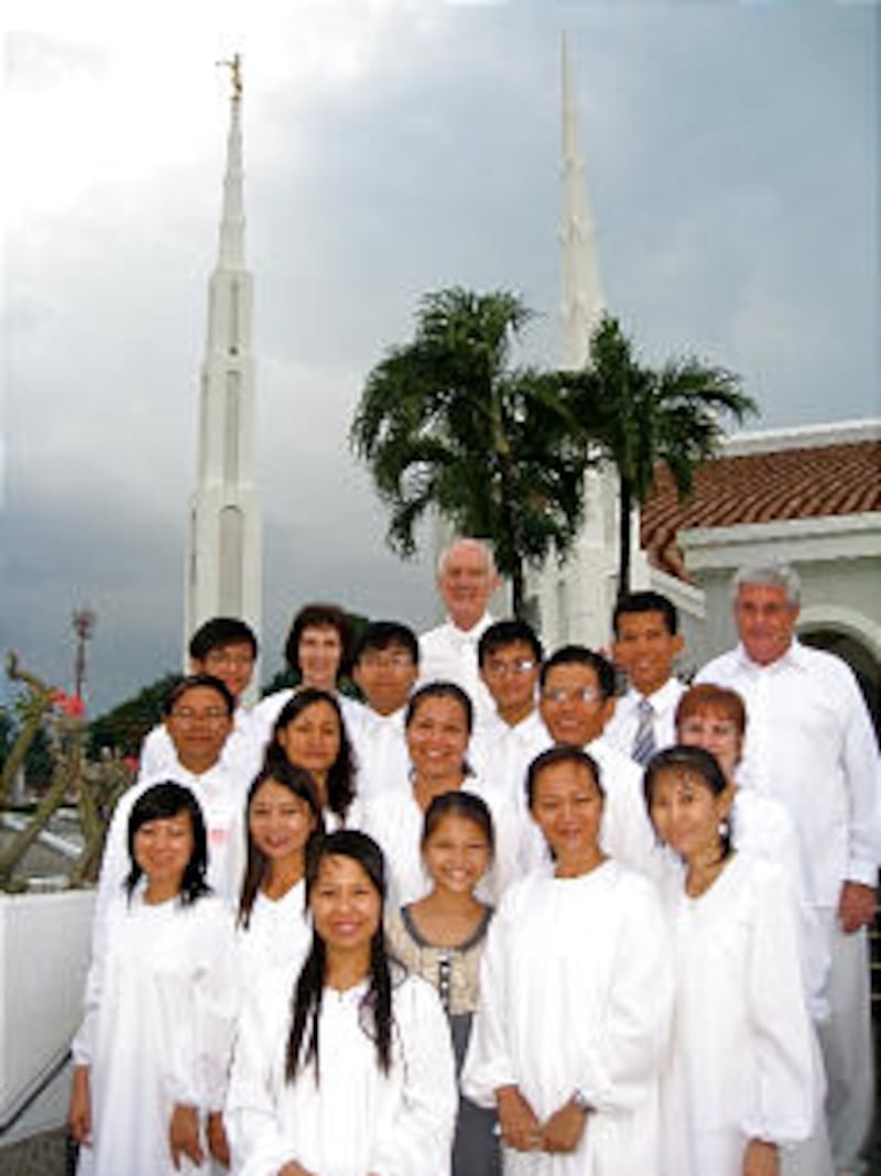 Vietnamese families from the Hanoi and Ho Chi Minh City branches meet with other guests at the Manil