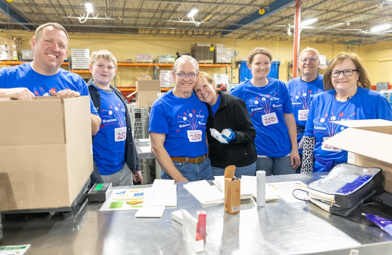 Volunteers help organize food donated by The Church of Jesus Christ of Latter-day Saints to Harvesters Food Bank in Kansas City, Missouri, on Thursday, April 23, 2026.