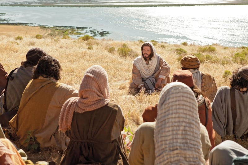 The Savior, Jesus Christ, is depicted teaching the sermon on the mount in a Bible Video.