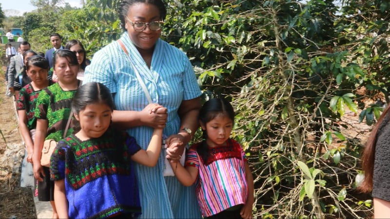 Sister Tracy Y. Browning holds the hands of two girls in Chenalhó, Chiapas, Mexico, on May 17, 2026.