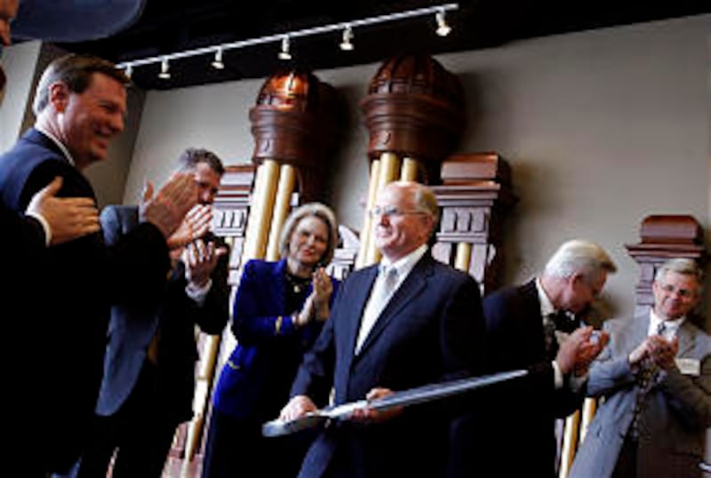 Participating in the ceremonial ribbon-cutting for the new Deseret Book Store on March 25 are, from